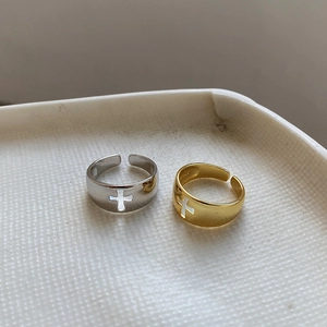 Detail of S925 sterling silver stamp on gold and silver hollow cross open rings
