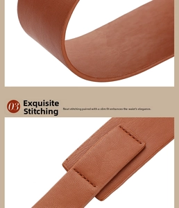 Detail shot of brown leather belt with lychee texture and neat reinforced stitching