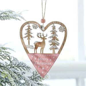 Pink heart-shaped wooden Christmas ornament with reindeer carving and silver bell