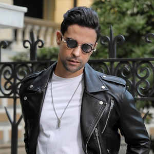 Steampunk round sunglasses on male model featuring black metal frames and retro aesthetic