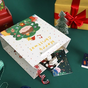 Cartoon Christmas paper gift bag with cute illustration and Merry Christmas text in white