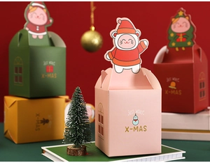 Christmas gift boxes with cute cartoon characters and golden X-MAS lettering details