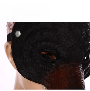 Detail of black animal wolf mask eye openings with clear sight and elastic strap