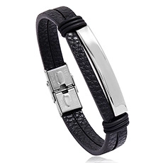 Macro detail of men's black braided leather bracelet with a polished silver metal plate