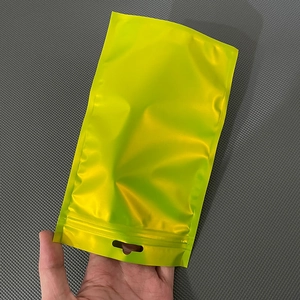Vibrant lime green stand-up matte foil pouch with ziplock and hanging hole detail