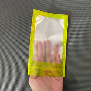 Detail of yellow matte zip lock bag with transparent window and top hanging hole