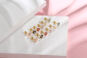 Close-up of colorful lip-shaped titanium steel stud earrings with secure screw backs