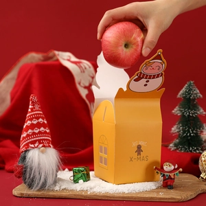 Yellow Christmas apple gift box with snowman lid and gingerbread man illustration