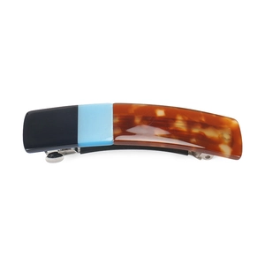 Classic acetate hair clip with black, light blue, and tortoiseshell patchwork design