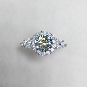 Luxurious silver ring with 2-carat round moissanite center stone and pavé setting