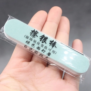 Dual-sided silver jewelry cleaning bar with polishing and grinding surfaces for oxidation