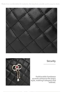 Detail of black quilted PU leather handbag with gold metal charm and red rhinestone