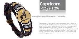 Detail of multi-layer braided leather bracelet with Capricorn zodiac bronze sign