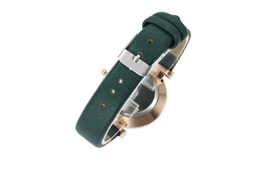 Detail of dark green leather watch strap with silver buckle and rose gold case