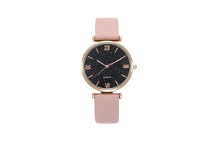 Detail of pink leather strap and starry sky dial with roman numerals quartz watch