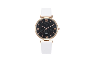 Detail of starry black dial with Roman numerals and white leather strap on women's watch