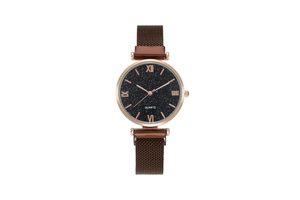 Detail of starry dial quartz watch with Roman numerals and magnetic mesh band