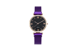 Detailed close-up of a starry sky dial watch with rose gold Roman numerals and mesh strap