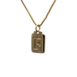 Golden box chain necklace with rectangular pendant featuring engraved letter F
