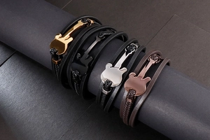 Multiple multilayer braided leather bracelets with guitar charms in gold, silver and black