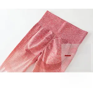 Detail of high-waisted seamless yoga pants with scrunch butt lifting effect in red blend