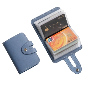 Blue leather card holder with 26 slots and snap closure shown in open and closed views
