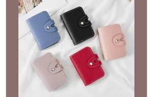 Litchi pattern leather card holders in five colors on silk fabric background