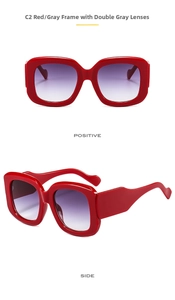 Macro detail of oversized red square frame sunglasses with gradient gray lenses