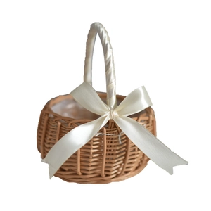 Handwoven flower girl basket with natural wood finish and elegant white ribbon handle bow