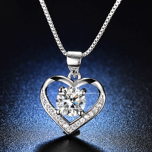 Macro view of heart-shaped S925 sterling silver necklace with large round-cut moissanite