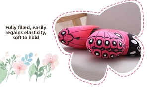 Macro detail of the realistic butterfly plush pillow with soft pink wings and black spots