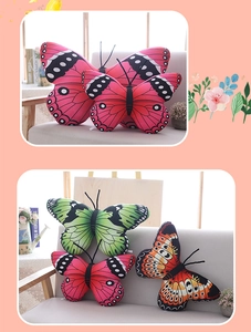 Colorful butterfly plush pillows in pink and green displayed on a cozy home sofa