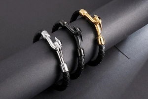 Detailed view of woven leather bracelets with silver, black, and gold metal hook clasps