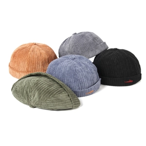 Corduroy brimless docker hats in five colors including orange and olive green for winter