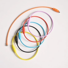 Macro view of colorful coated wire keychains with secure metal screw connectors