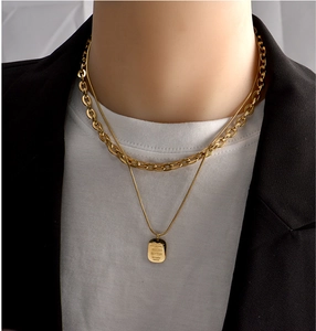 Minimalist double-layered gold necklace with square pendant and sleek metal chains