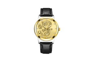 Detail view of a gold dragon relief dial with inlaid rhinestones on a men's quartz watch