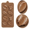 Detailed view of leaf-shaped cavities on a brown silicone mold for baking and chocolate