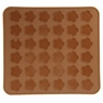 Top view of brown square silicone mold with multiple flower-shaped cavities for baking