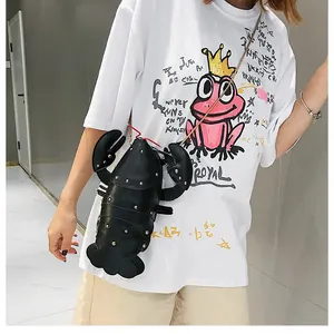 Detailed view of cartoon lobster crossbody bag with gold studs and metal chain strap