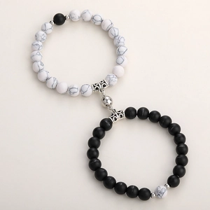 Macro detail of natural stone couple bracelets with magnetic ball clasp and alloy beads