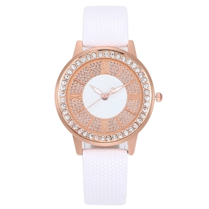 Elegant rose gold women's watch with sparkling crystals and a white honeycomb strap