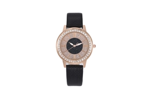 Close-up of rose gold crystal bezel and starry black dial on a quartz ladies watch