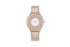 Close-up of rose gold watch with crystal encrusted dial and diamond pattern strap
