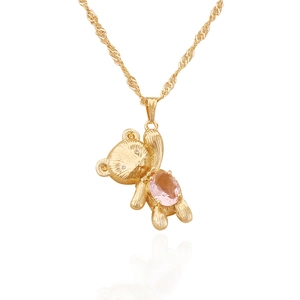 Golden bear pendant necklace with pink gemstone on water wave chain over white background