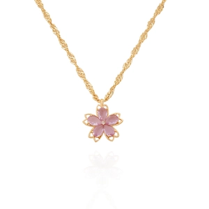 Close-up of pink cherry blossom pendant with crystal center on a gold chain