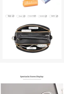 Top view of black leather handbag showing multi-layer zippers and internal compartments