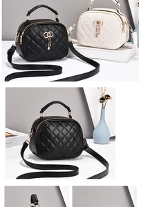 Detailed macro view of quilted texture and gold hardware on stylish women handbag