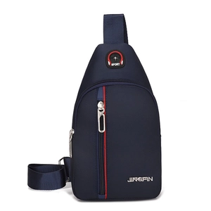 Detail of navy blue nylon chest bag featuring adjustable strap and red decorative zipper trim