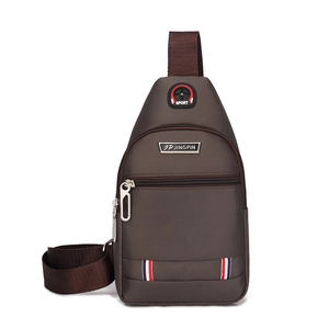 Detail view of brown Oxford fabric chest bag with adjustable strap and Sport logo